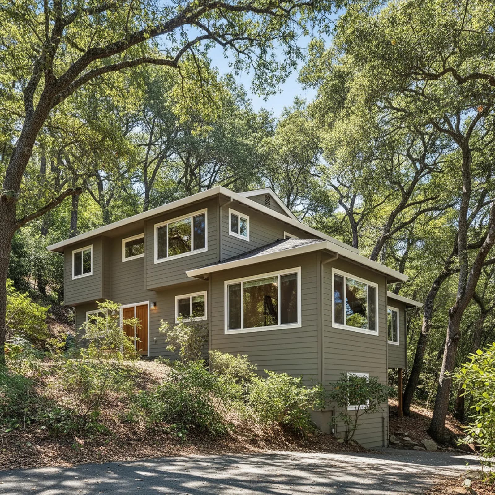 Hillside re-side, San Anselmo CA Fire-hardened, moisture-managed fiber cement siding on a wooded San Anselmo California hillside home